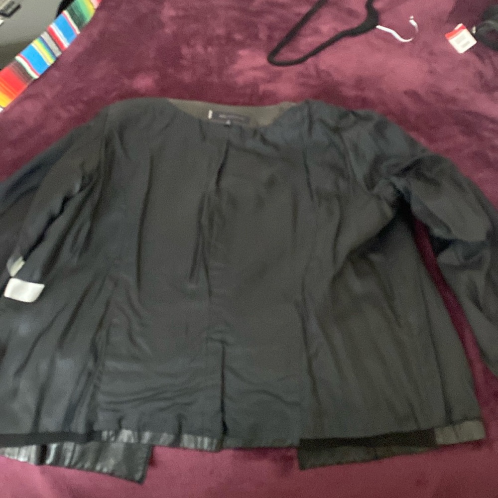 Anne Klein
Mandarin Collar
Lined, Soft Leather
Cloth Back & Arm Panel - Picture 3 of 7